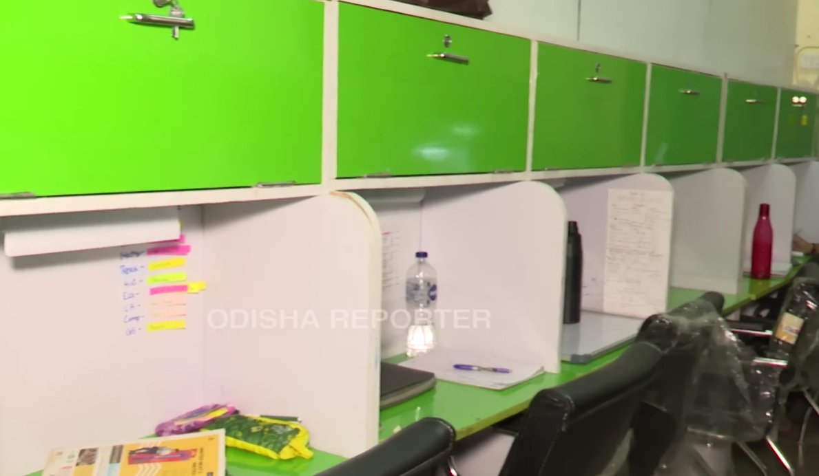 Green locker units and individual study cubicles at a Bhubaneswar reading hub